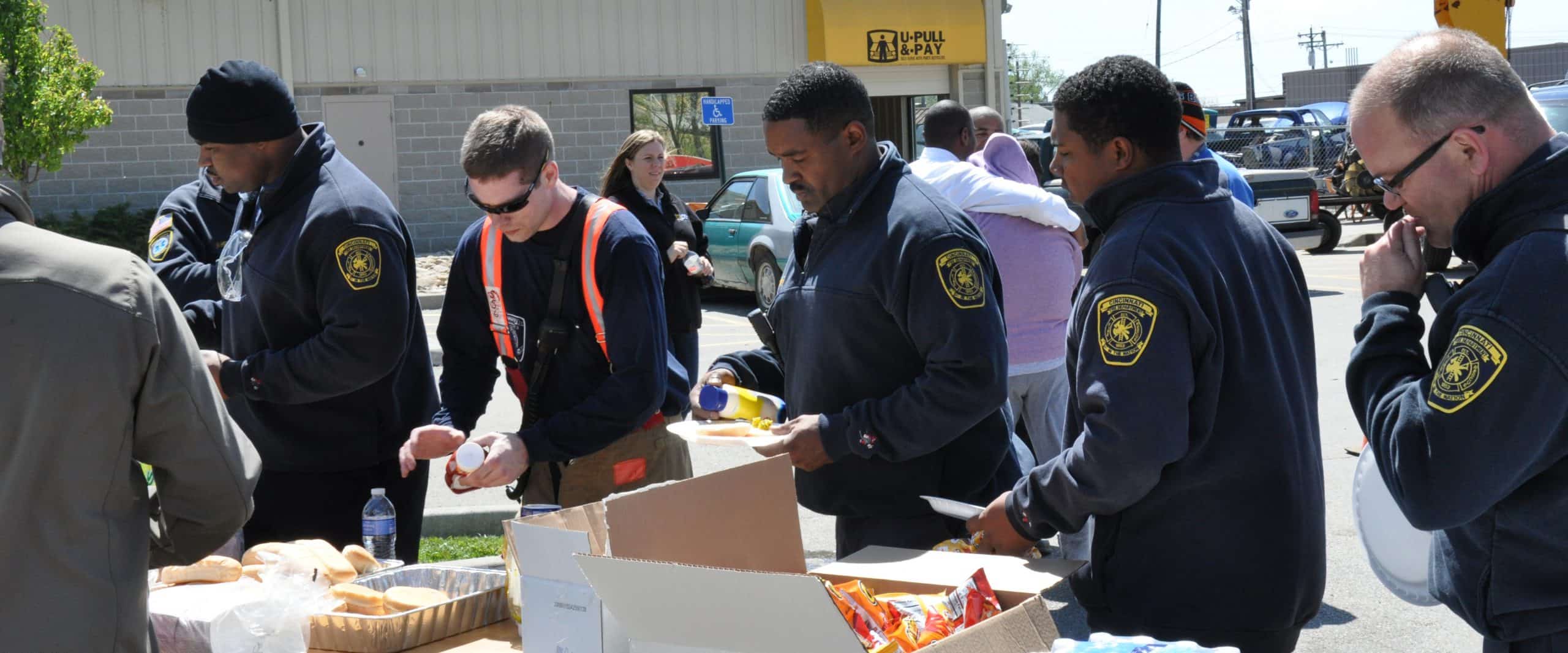 serving lunch to group of fire fighters