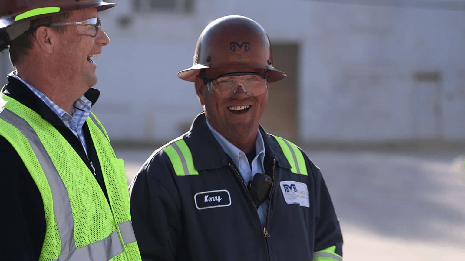 two site employees laughing