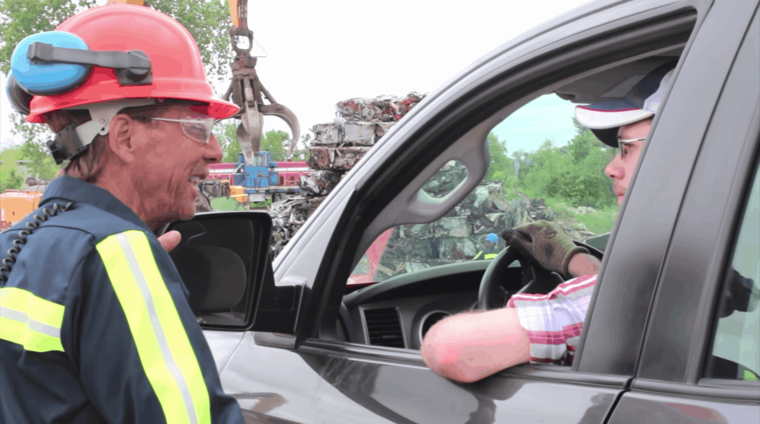 worker talking to customer in truck